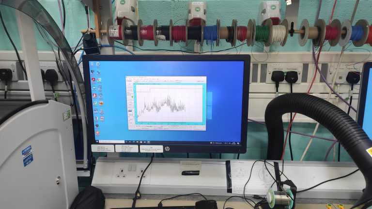Computer showing a visual display readout during electromagnetric of AVS devices in a lab