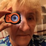 Patient being examined in their home using the Lumio anterior eye examination tool to test vision