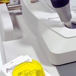 Aston Vision Sciences Fluorescein filter next to Slit Lamp ready for dry eye testing