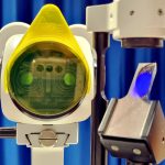 Aston Vision Sciences watten filter attached to a CSO slit lamp, showcasing blue light source used in optometry fluorescein examinations