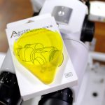 Aston Vision Sciences Fluorescein filter resting on its' packaging on top of a slit lamp