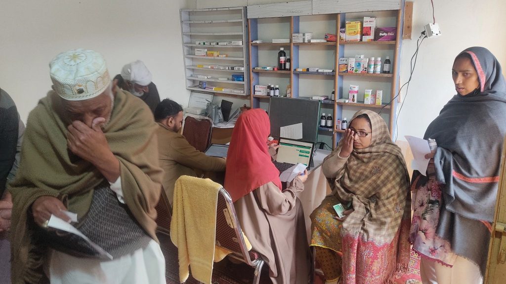 Patient sitting and standing waiting for eye tests